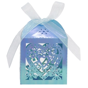 Detail of laser-cut heart pattern on blue-purple gradient wedding favor candy gift box