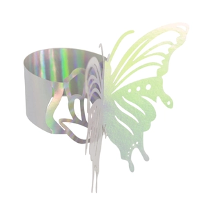 Macro view of holographic butterfly napkin ring with laser-cut hollow details on silver
