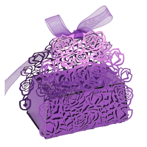 Detail of laser-cut rose patterns on purple gift box with matching organza ribbon