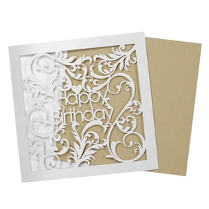 Laser cut white Happy Birthday card with elegant vine patterns and kraft envelope