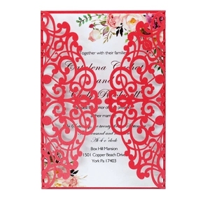 Detailed laser-cut hollow pattern and floral interior of the dark red wedding invitation