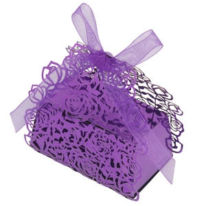 Detail of purple laser-cut rose gift box with pearlescent finish and organza ribbon bow