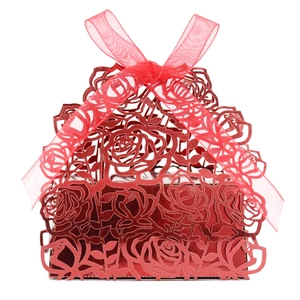 Elegant red laser-cut rose hollow candy box with silk ribbon bow for weddings and parties