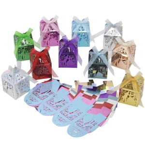 Laser-cut wedding candy boxes featuring bride and groom silhouettes in various metallic colors