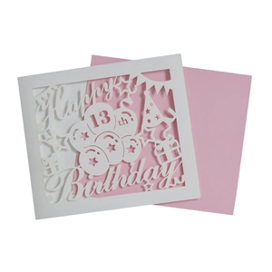 Detailed laser-cut Happy 13th Birthday card with pink insert and party elements