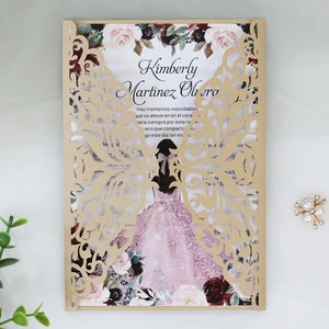 Close-up of laser-cut butterfly invitation with gold finish and floral girl illustration