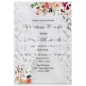 Laser cut floral wedding invitation with watercolor roses and elegant white lace design