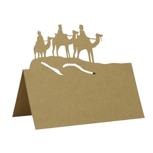 Detail view of laser-cut kraft paper camel place card with standing 3D fold design