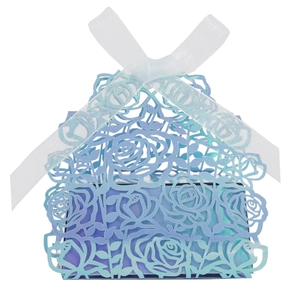 Detailed laser-cut rose pattern on blue-purple gradient paper gift box with ribbon
