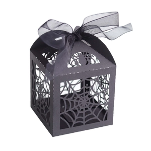Halloween black laser-cut spider web candy box with a black ribbon bow on white background