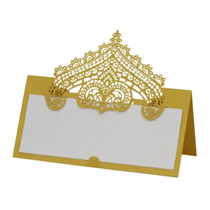 Detailed laser-cut gold lace crown place card with white blank space for guest names