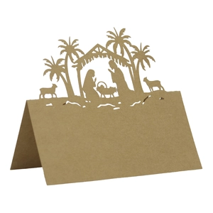 Laser-cut brown kraft paper place card featuring a Nativity scene with holy family design