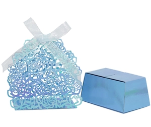 Detail of laser-cut rose hollow favor box with light blue finish and white ribbon