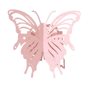 Close-up of pink laser-cut butterfly napkin ring with matte and glitter finish details