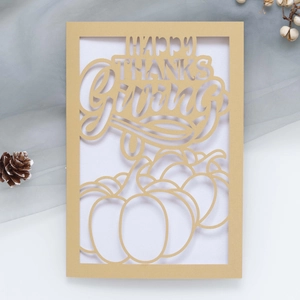 Laser-cut Happy Thanksgiving invitation card featuring golden pumpkins and festive lettering