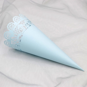 Detailed view of a light blue lace hollow paper cone for wedding petals and party favors