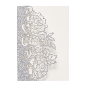 Intricate laser-cut floral wedding invitation card in silver glitter finish on white background