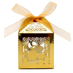 Detail of golden laser-cut Eid candy box featuring mosque and star moon patterns