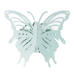 Close-up of laser-cut light blue butterfly napkin ring with intricate hollowed patterns