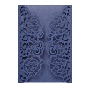 Detailed laser-cut rose pattern on premium pearlescent navy blue invitation covers