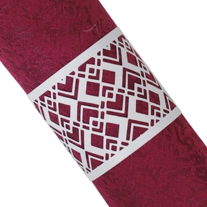 Laser-cut black hollow napkin ring with geometric patterns for wedding and banquet table decor