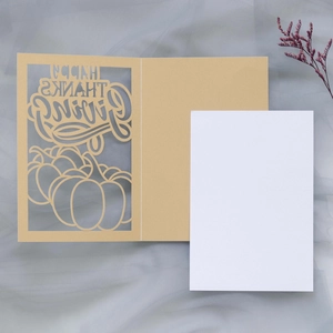 Detail of laser-cut pumpkin Happy Thanksgiving card with blank white insert and kraft envelope