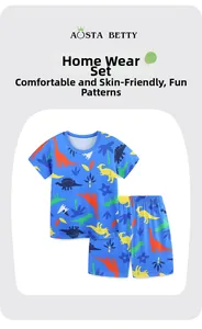Flat lay detail of kids blue pajamas set with colorful cartoon dinosaur prints