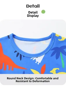 Detail of crew neck design on boys' cotton pajamas with colorful dinosaur prints