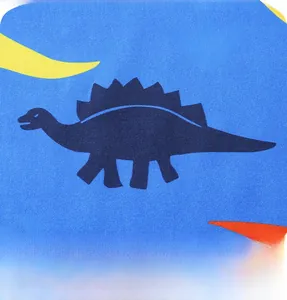 Detail of vibrant blue fabric featuring colorful cartoon dinosaur prints for boys' sets