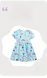 Detail of light blue cotton summer dress with colorful unicorn and dinosaur prints