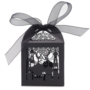 Detail of black laser-cut candy box featuring hollow mosque and crescent moon design