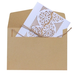European kraft paper invitation with laser-cut lace card and decorative twine bow