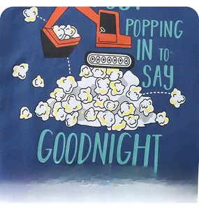 Detail of navy knit cotton shirt with orange excavator and popcorn graphic print