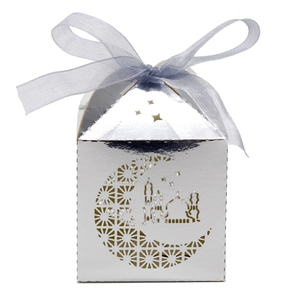 Silver laser-cut candy box with crescent moon and blue ribbon for Eid party favors