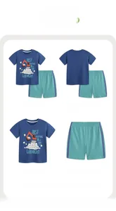 Detail view of boys summer set with excavator print t-shirt and green elastic waist shorts