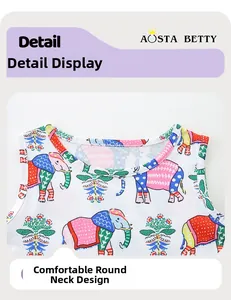 Close-up of comfortable round neckline on girl's summer dress with colorful elephant print