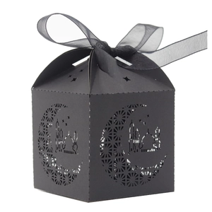 Black laser-cut hollow candy box with Islamic moon star patterns and ribbon bow