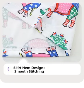 Detail of child dress hemline featuring colorful elephant print and smooth stitching