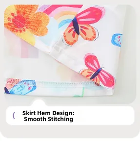 Détail de l'ourlet de robe avec coutures soignées et imprimé floral arc-en-ciel vif