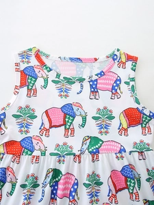 Girls summer dress with colorful elephant print and floral patterns on white cotton fabric