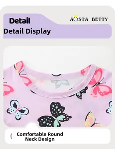 Detalle del cómodo cuello redondo con estampados de mariposas en vestido de niña verano