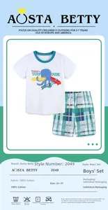 Detail view of cotton boy's set with octopus surf T-shirt and plaid shorts outfit