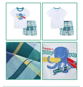 Detail of boys' cotton T-shirt with octopus embroidery and checkered shorts set