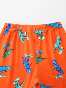Kids orange summer shorts with blue dinosaur skateboard print and elastic waist