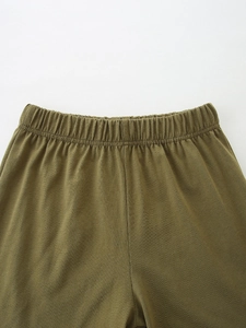 Olive green boys cotton knit shorts with wide elastic waistband and soft texture