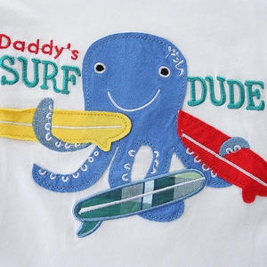 Toddler white cotton T-shirt featuring octopus embroidery and surf dude theme graphics