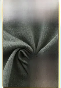 Vue macro du tissu en maille 100 % coton doux pour ensembles d'été à motif dinosaure enfant