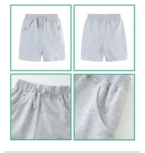 Detail view of light gray knit cotton shorts with drawstring waist and side pockets