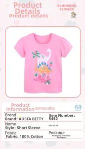 Close-up of pink cotton T-shirt featuring cartoon dinosaur and palm tree prints