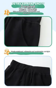 Detail of black cotton jogger pants with side pockets and a drawstring elastic waistband